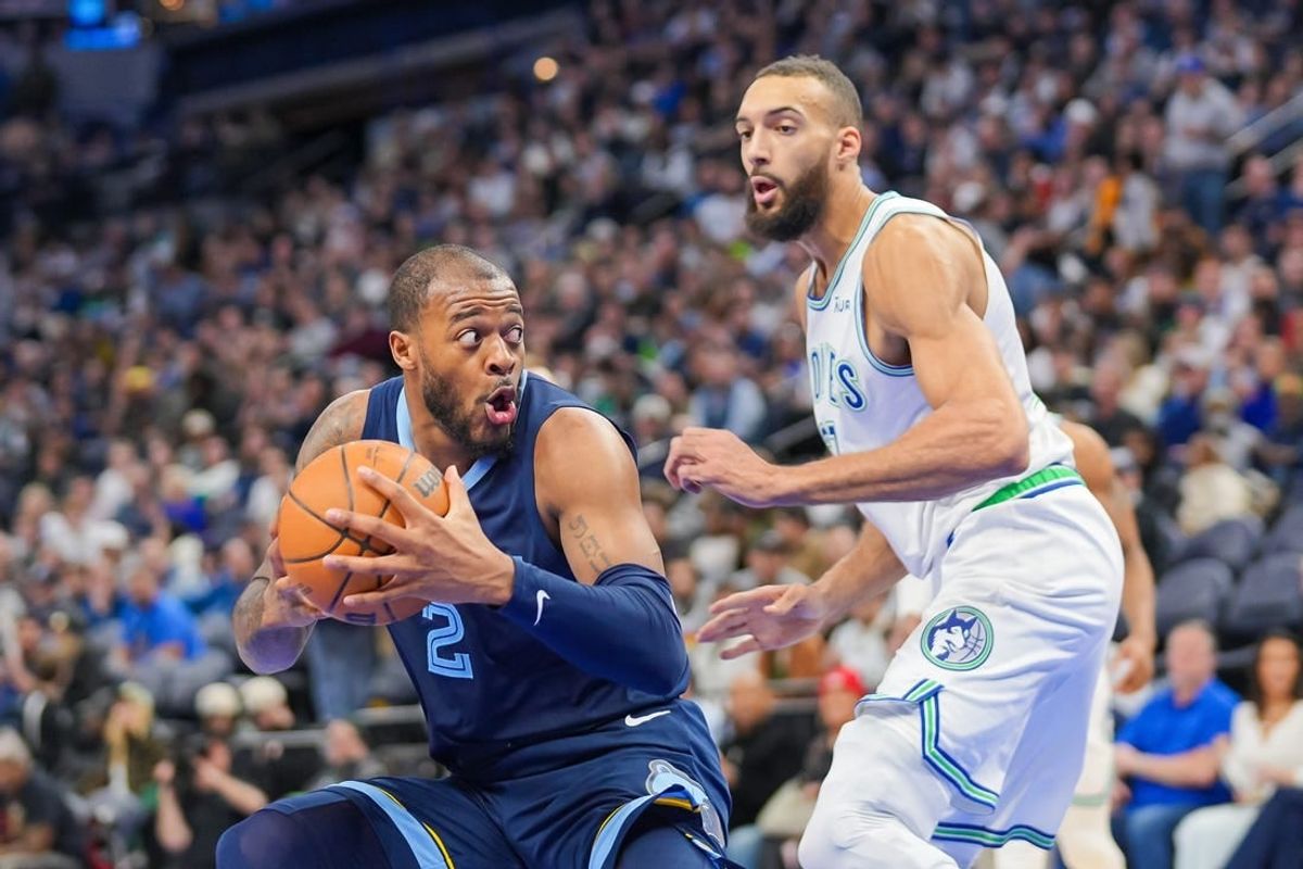 Jan 18, 2024; Minneapolis, Minnesota, USA; Memphis Grizzlies forward Xavier Tillman (2) drives against the Minnesota Timberwolves center Rudy Gobert (27) in the third quarter at Target Center.