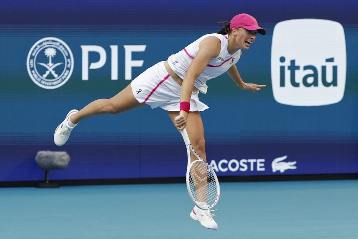 Mar 23, 2024; Miami Gardens, FL, USA; Iga Swiatek (POL) serves against Camila Giorgi (ITA)(not pictured) on day six of the Miami Open at Hard Rock Stadium.