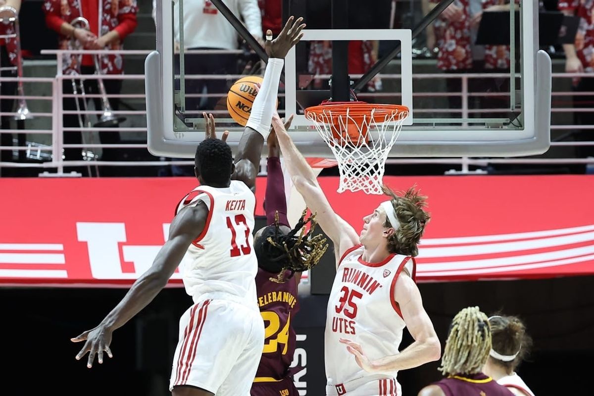 Feb 10, 2024; Salt Lake City, Utah, USA; Utah Utes center Branden Carlson (35) blocks the shot of Arizona State Sun Devils forward Bryant Selebangue (24) during the second half to become the all time Utah Utes shot block leader at Jon M. Huntsman Center.