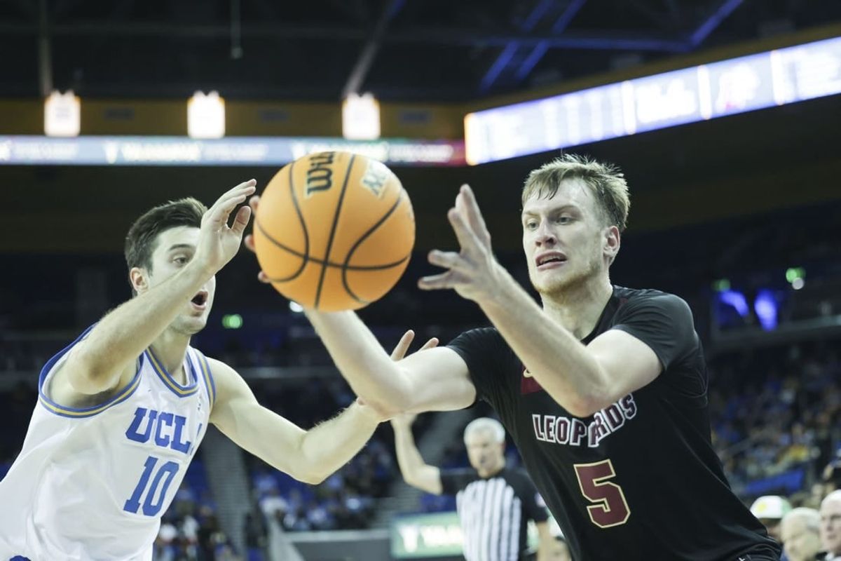Nov 10, 2023; Los Angeles, California, USA; Lafayette guard Eric Sondberg (5) catches the ball as UCLA guard Lazar Stefanovic (10) defends in the second half at Pauley Pavilion presented by Wescom.