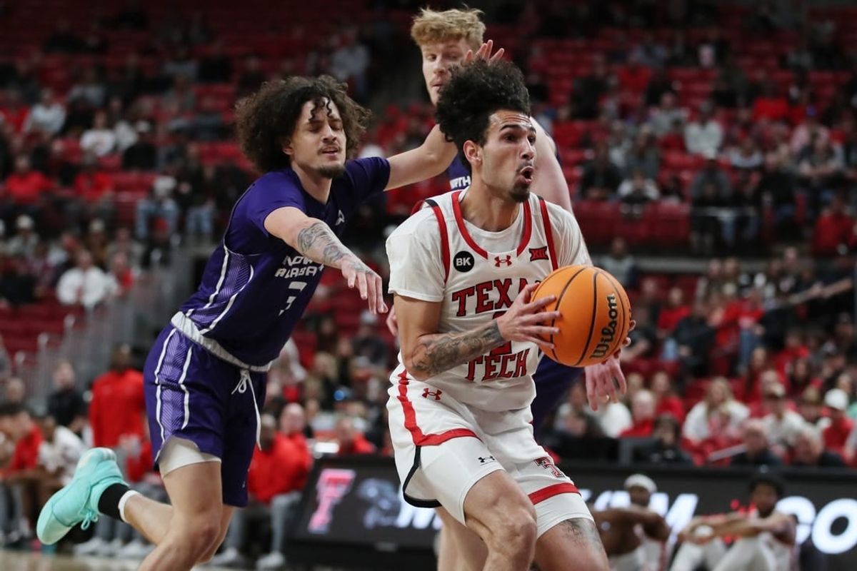 Jan 1, 2024; Lubbock, Texas, USA; Texas Tech Red Raiders guard Pop Isaacs (2) stops to take a shot against  North Alabama Lions guard KJ Johnson (3) in the first half  at United Supermarkets Arena.