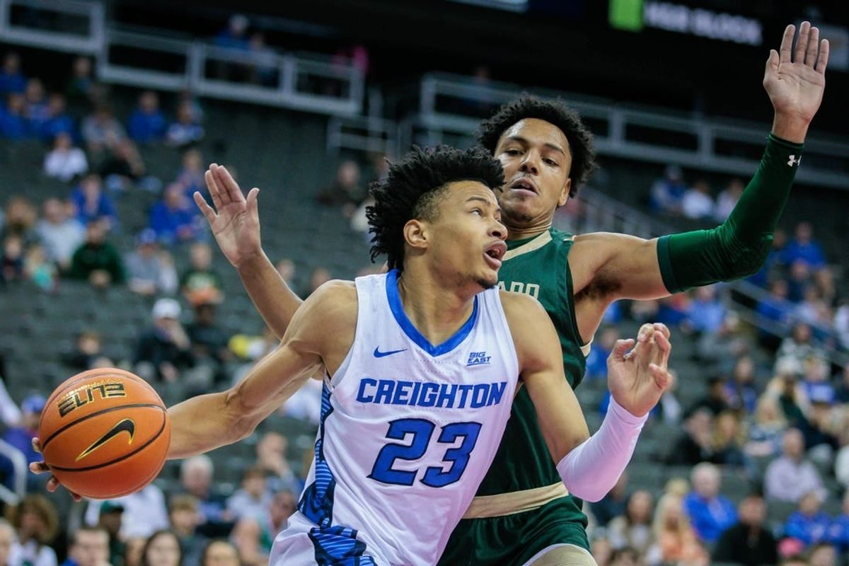 Nov 23, 2023; Kansas City, Missouri, USA; Creighton Bluejays guard Trey Alexander (23) drives around Colorado State Rams guard Nique Clifford (10) at T-Mobile Center.