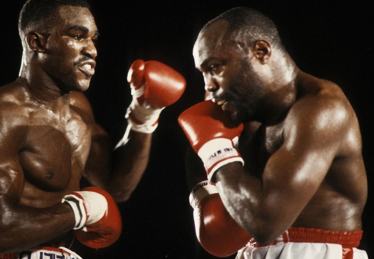 Jul 12, 1986; Atlanta, GA, USA; FILE PHOTO; Evander Holyfield battles Dwight Muhammad Qawi during their 1986 cruiserweight title match at the Omni. Holyfield defeated Qawi by split decision. Mandatory Credit: Manny Rubio-Imagn Images