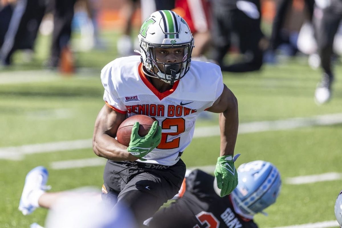 Jan 30, 2024; Mobile, AL, USA; National running back Rasheen Ali of Marshall (22) runs the ball during practice for the National team at Hancock Whitney Stadium.