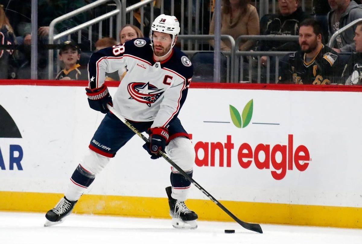 Mar 28, 2024; Pittsburgh, Pennsylvania, USA;  Columbus Blue Jackets center Boone Jenner (38) handles the puck against the Pittsburgh Penguins during the first period at PPG Paints Arena.