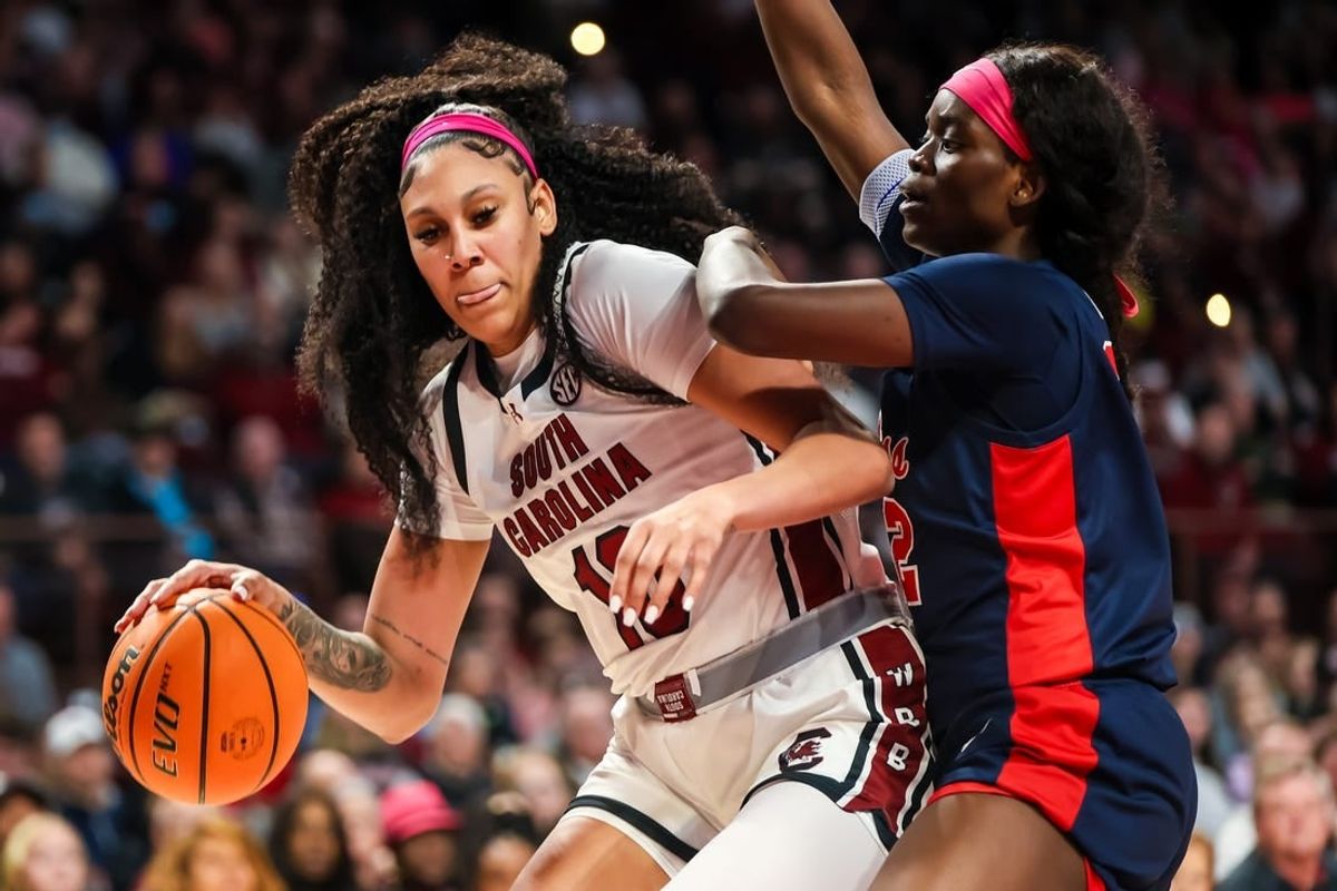 Feb 4, 2024; Columbia, South Carolina, USA; South Carolina Gamecocks center Kamilla Cardoso (10) dribbles around Ole Miss Rebels center Rita Igbokwe (32) in the first half at Colonial Life Arena.