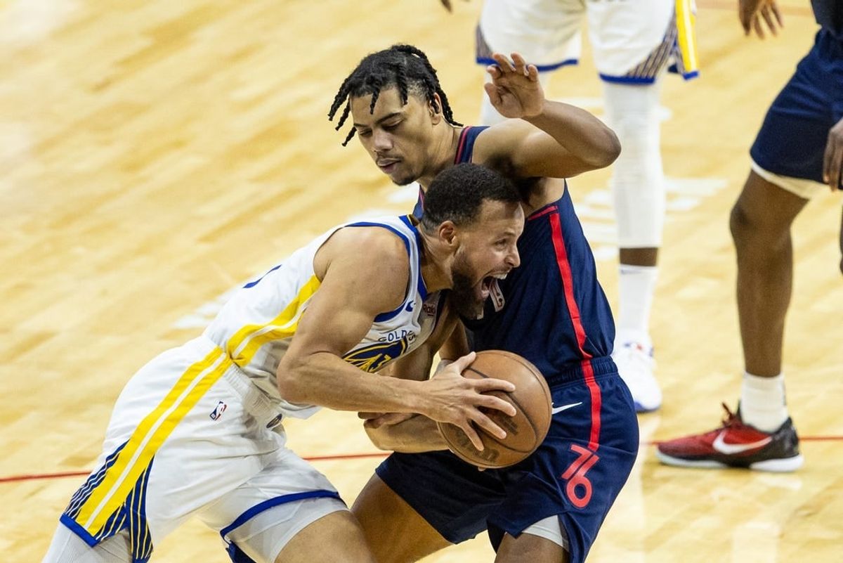 Feb 7, 2024; Philadelphia, Pennsylvania, USA; Golden State Warriors guard Stephen Curry (30) drives against Philadelphia 76ers guard Jaden Springer (11) during the second quarter at Wells Fargo Center.