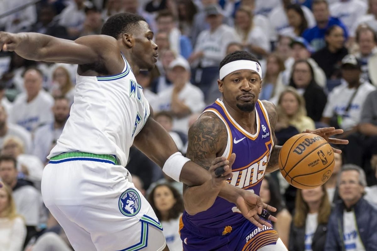 Apr 20, 2024; Minneapolis, Minnesota, USA;Phoenix Suns guard Bradley Beal (3) drives to the basket past Minnesota Timberwolves guard Anthony Edwards (5) in the first half during game one of the first round for the 2024 NBA playoffs at Target Center.