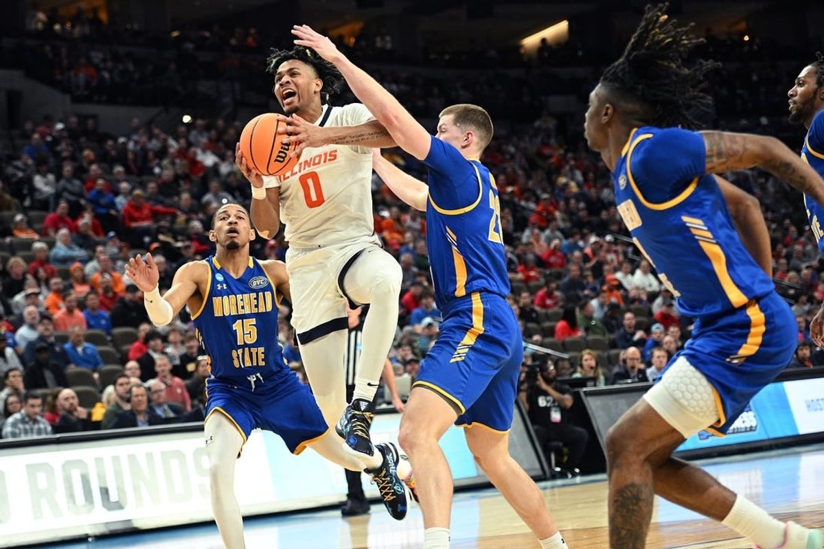 Mar 21, 2024; Omaha, NE, USA; Illinois Fighting Illini guard Terrence Shannon Jr. (0) drives against Morehead State Eagles guard Riley Minix (22) in the first half during the first round of the NCAA Tournament at CHI Health Center Omaha.