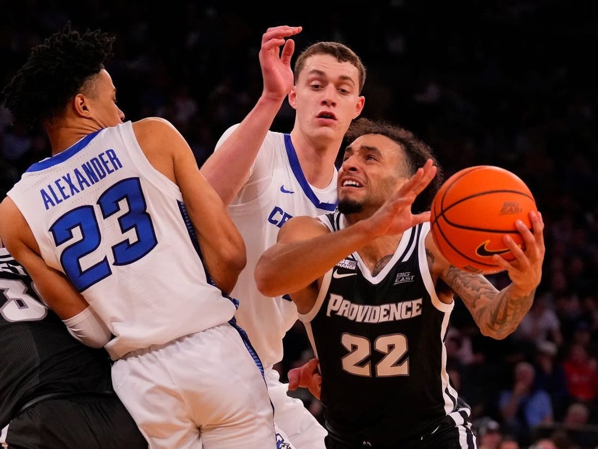 Mar 14, 2024; New York City, NY, USA;  Providence Friars guard Devin Carter (22) drives on Creighton Bluejays guard Trey Alexander (23) and center Ryan Kalkbrenner (11) during the second half at Madison Square Garden.
