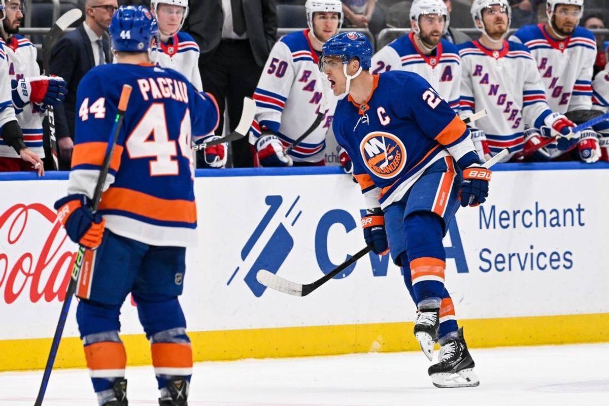 Apr 9, 2024; Elmont, New York, USA; New York Islanders left wing Anders Lee (27) celebrates his empty net goal against the New York Rangers during the third period at UBS Arena.