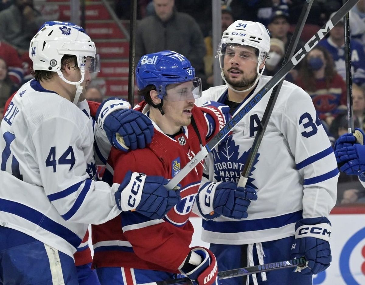Mar 9, 2024; Montreal, Quebec, CAN; Toronto Maple Leafs defenseman Morgan Rielly (44) and teammate Toronto Maple Leafs forward Auston Matthews (34) escort Montreal Canadiens forward Brendan Gallagher (11) away from their net during the second period at the Bell Centre.