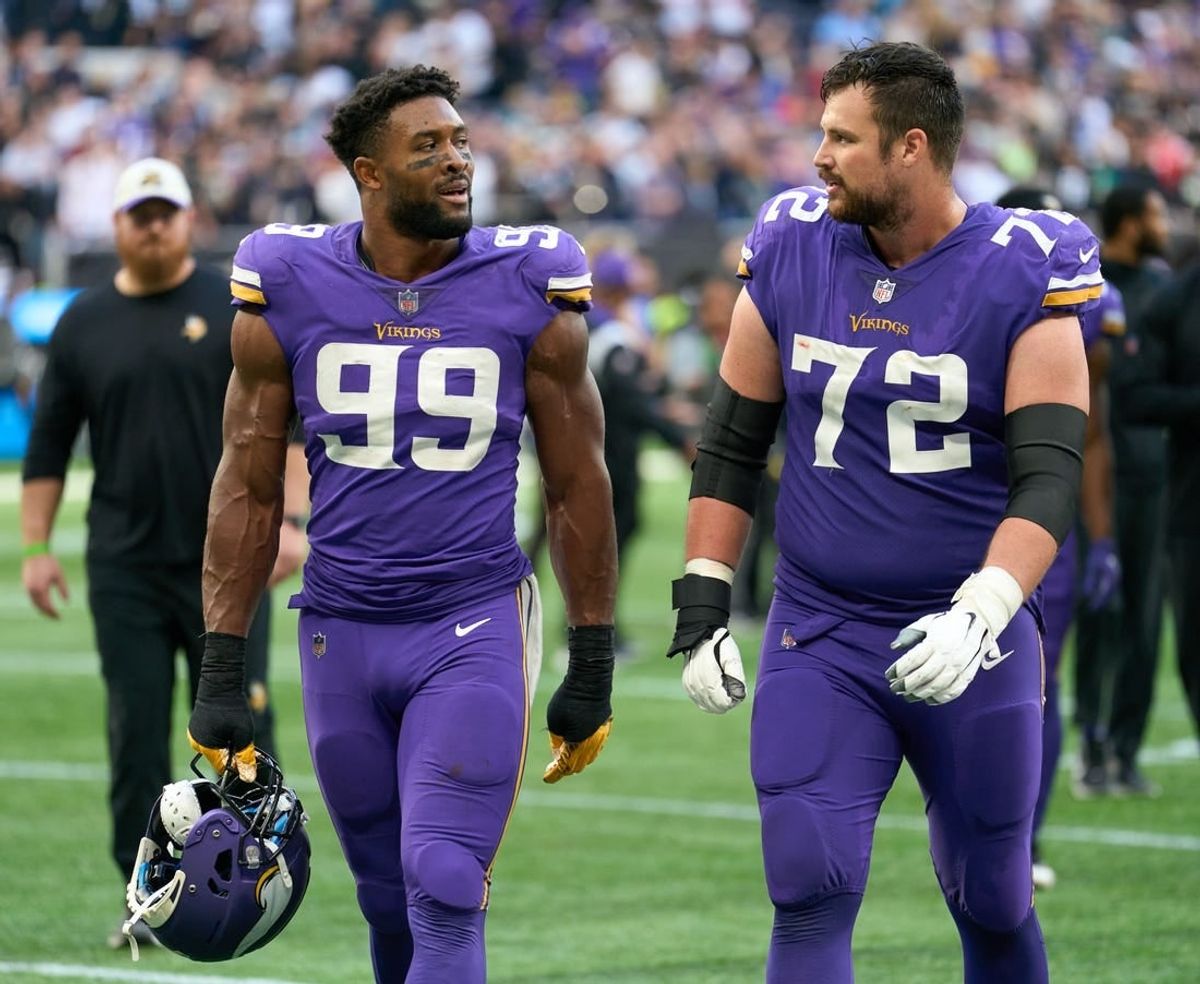 Oct 2, 2022;  London, United Kingdom;  Minnesota Vikings linebacker Danielle Hunter (99) and Minnesota Vikings guard Ezra Cleveland (72) during the NFL International Series game at Tottenham Hotspur Stadium.