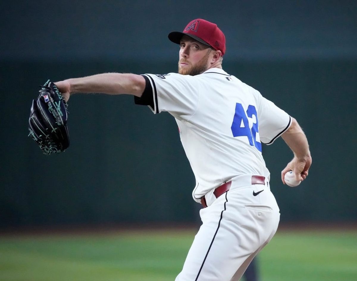 Arizona Diamondbacks starting pitcher Merrill Kelly throws against the Chicago Cubs during the first inning at Chase Field. All players are wearing number 42 in honor of Jackie Robinson Day.