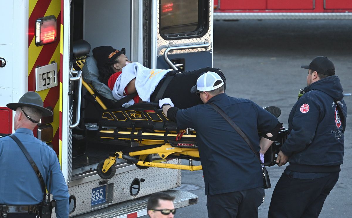 Medical personnel load a woman into an ambulance after a shooting at 
Union Station after the Kansas City Chiefs Super Bowl LVIII victory 
parade