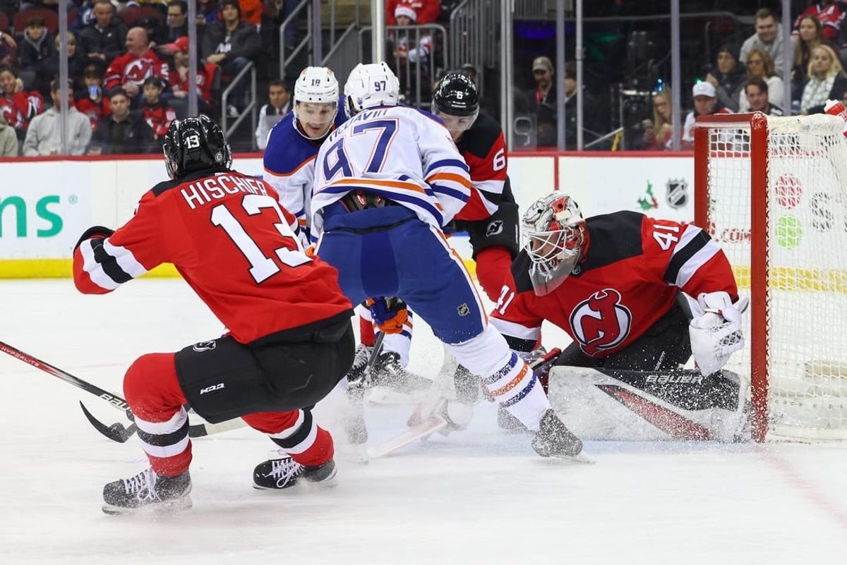 Dec 21, 2023; Newark, New Jersey, USA; New Jersey Devils goaltender Vitek Vanecek (41) makes a save on Edmonton Oilers center Connor McDavid (97) during the first period at Prudential Center.