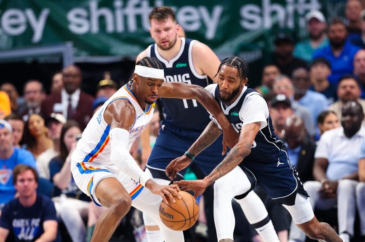 May 11, 2024; Dallas, Texas, USA; Oklahoma City Thunder guard Shai Gilgeous-Alexander (2) fouls Dallas Mavericks forward Derrick Jones Jr. (55) during the first half during game three of the second round for the 2024 NBA playoffs at American Airlines Center.
