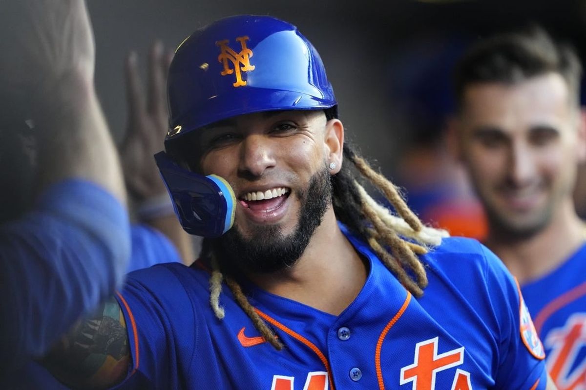 Sep 14, 2023; New York City, New York, USA; New York Mets third baseman Jonathan Arauz (19) is congratulated by teammate for hitting a three run home run against the Arizona Diamondbacks during the eighth inning at Citi Field.