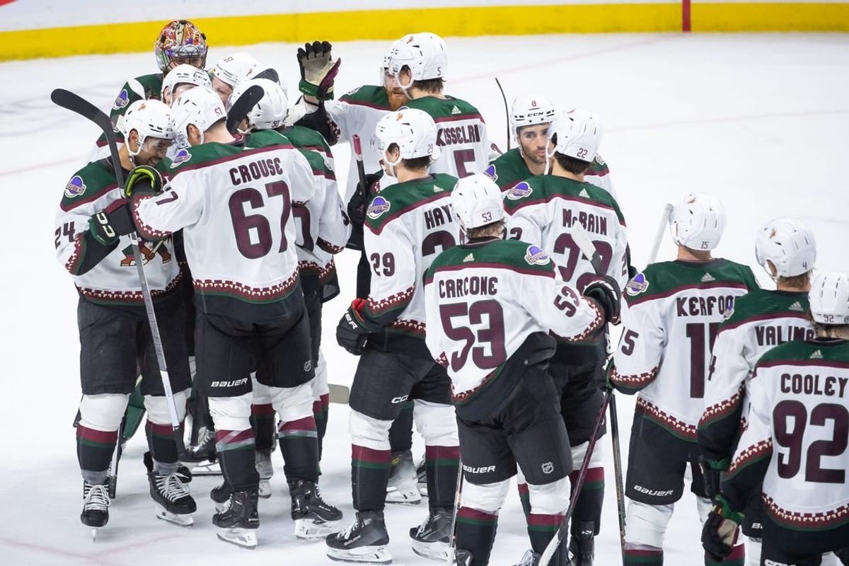Mar 1, 2024; Ottawa, Ontario, CAN; The Arizona Coyotes celebrate their win against the Ottawa Senators at the Canadian Tire Centre.