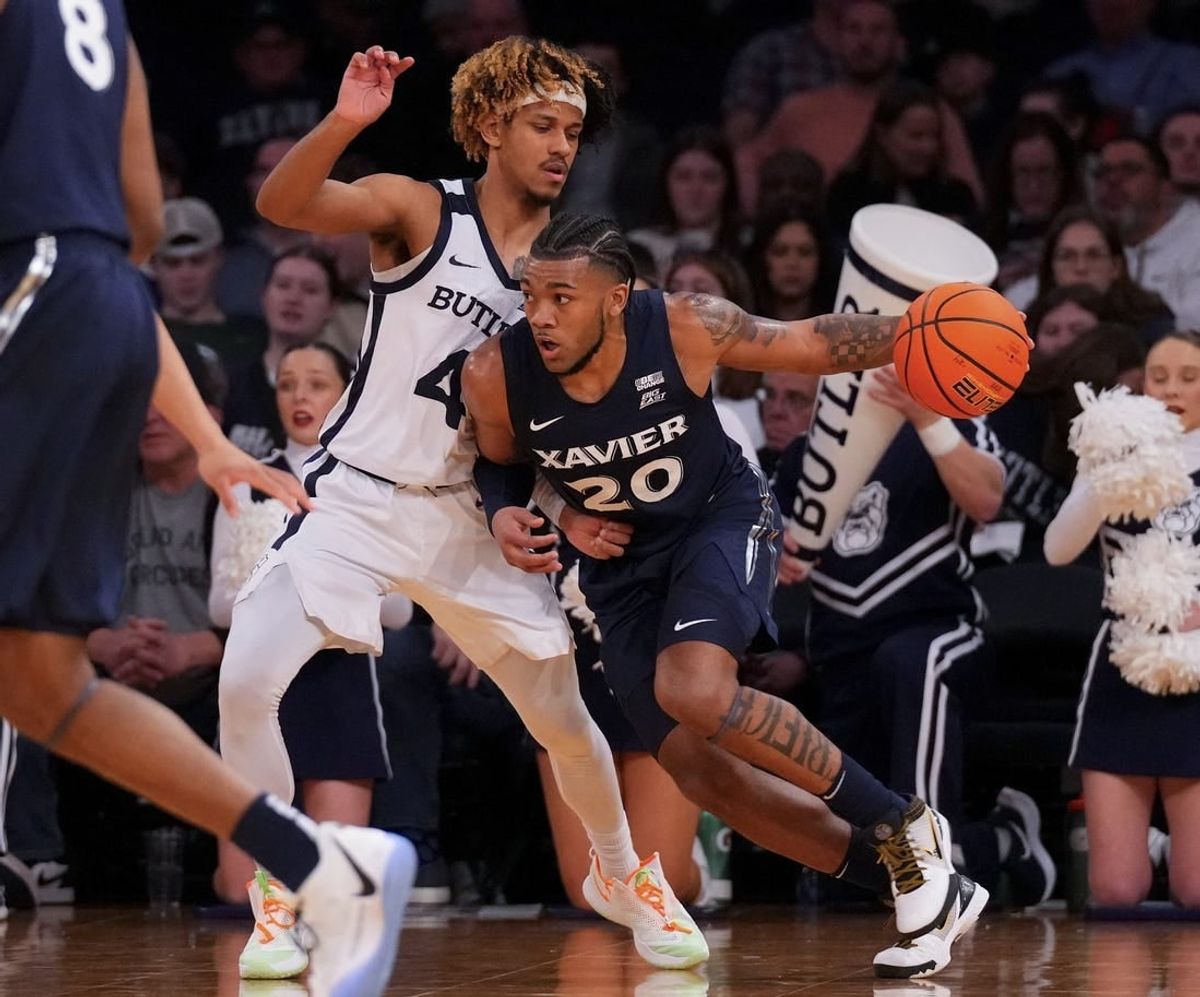 Mar 13, 2024; New York City, NY, USA; Xavier Musketeers guard Dayvion McKnight (20) drives on Butler Bulldogs guard DJ Davis (4) during the first half at Madison Square Garden.