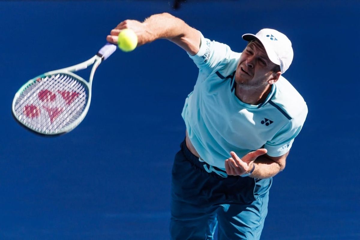 Jan 24, 2024; Melbourne, Victoria, Australia;  Hubert Hurkacz of Poland in action against Daniil Medvedev of Russia in the quarter final of the men   s singles at the Australian Open.
