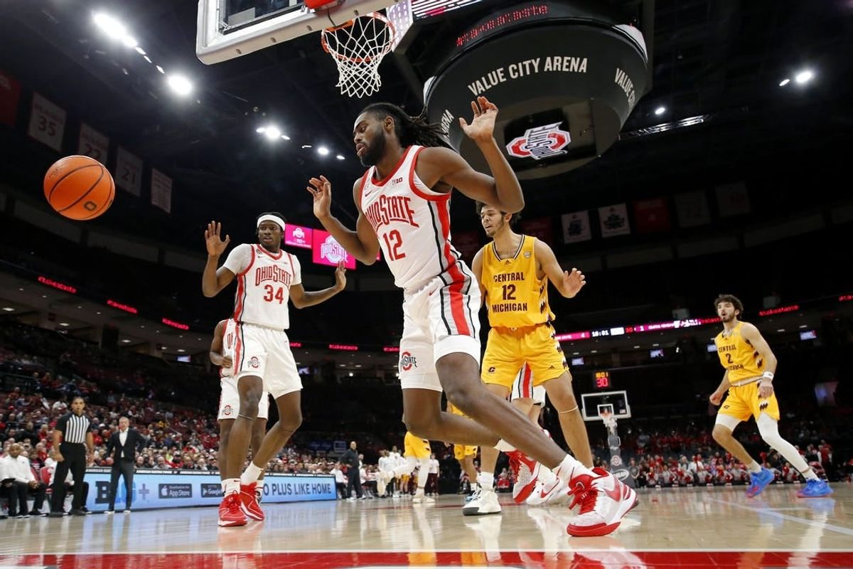 Nov 29, 2023; Columbus, Ohio, USA; Ohio State Buckeyes center Felix Okpara (34) and guard Evan Mahaffey (12) blocks the shot of Central Michigan Chippewas center Hunter Harding (12) during the first half at Value City Arena.
