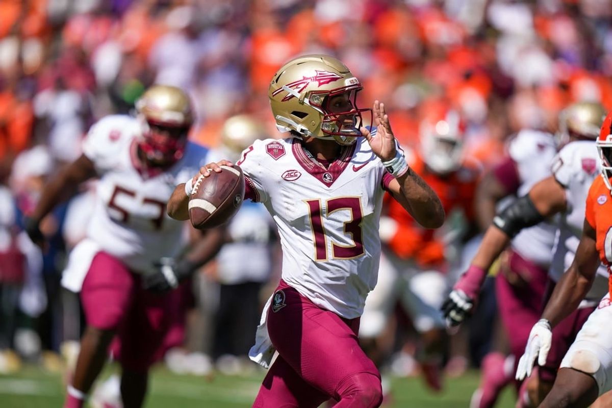 Sep 23, 2023; Clemson, South Carolina, USA; Florida State Seminoles quarterback Jordan Travis (13) in the second half against the Clemson Tigers at Memorial Stadium.