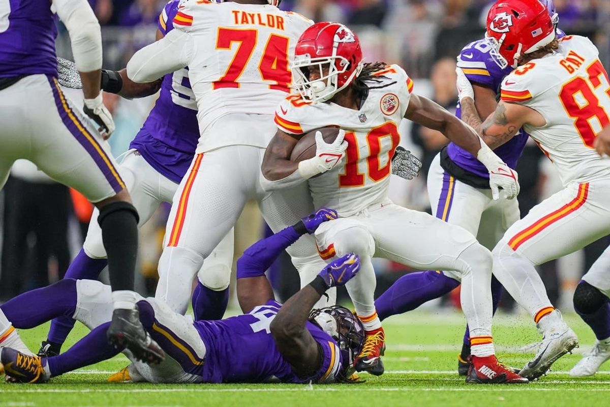 Oct 8, 2023; Minneapolis, Minnesota, USA; Kansas City Chiefs running back Isiah Pacheco (10) runs with the ball against the Minnesota Vikings in the fourth quarter at U.S. Bank Stadium.