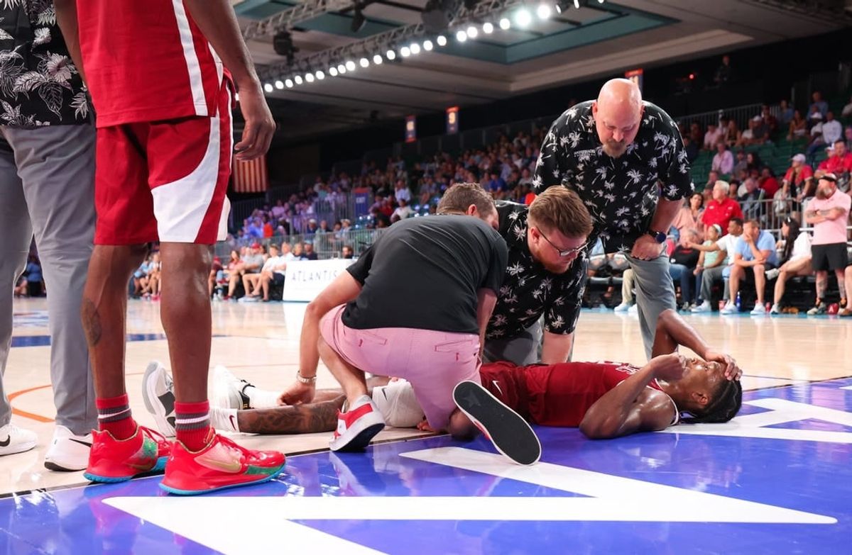 Nov 24, 2023; Paradise Island, BAHAMAS;  Arkansas Razorbacks guard Tramon Mark (12) lays injured on the ground during the second half against the North Carolina Tar Heels at Imperial Arena.