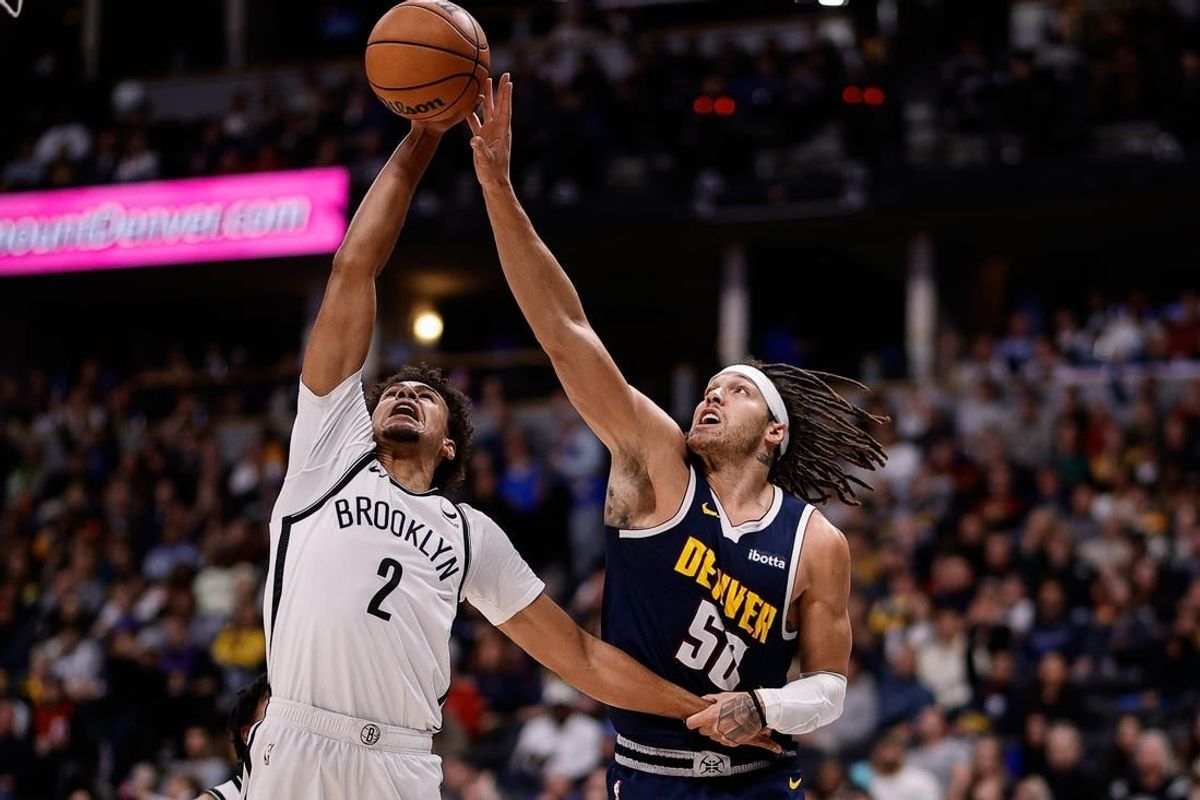 Dec 14, 2023; Denver, Colorado, USA; Brooklyn Nets forward Cam Johnson (2) and Denver Nuggets forward Aaron Gordon (50) battle for the ball in the third quarter at Ball Arena.