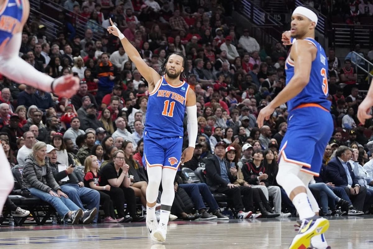 Apr 9, 2024; Chicago, Illinois, USA; New York Knicks guard Jalen Brunson (11) reacts after making a three point basket against the Chicago Bulls during the second half at United Center.