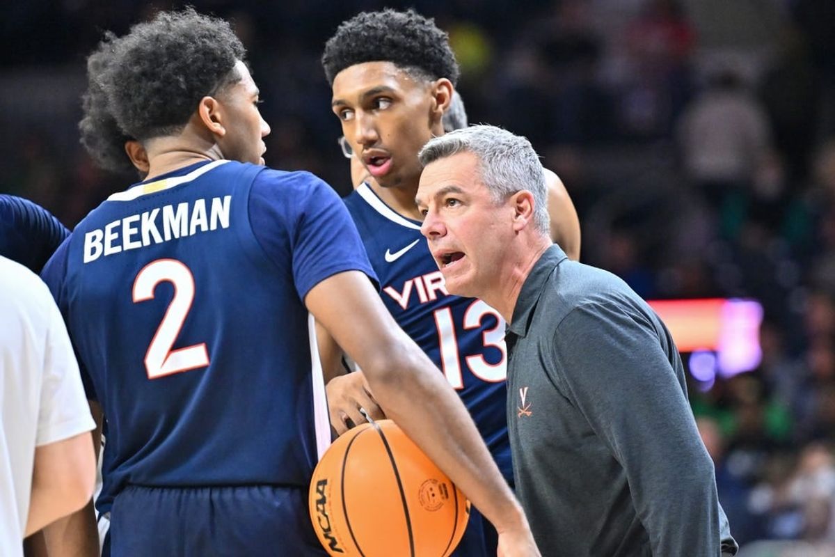 Dec 30, 2023; South Bend, Indiana, USA; Virginia Cavaliers head coach Tony Bennett talks to guard Reece Beekman (2) and guard Ryan Dunn (13) in the second half against the Notre Dame Fighting Irish at the Purcell Pavilion.