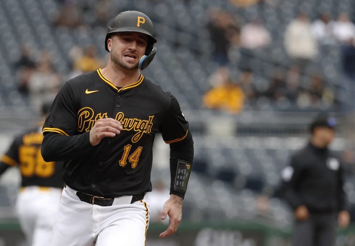 Apr 25, 2024; Pittsburgh, Pennsylvania, USA;  Pittsburgh Pirates catcher Joey Bart (14) scores a run against the Milwaukee Brewers during the fifth inning at PNC Park.