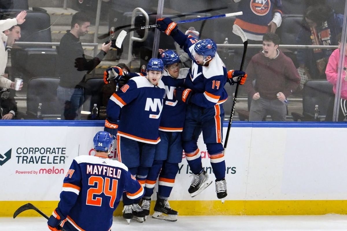 Dec 9, 2023; Elmont, New York, USA; New York Islanders left wing Anders Lee (27) celebrates with teammates after scoring a goal against the Los Angeles Kings during the third period at UBS Arena.