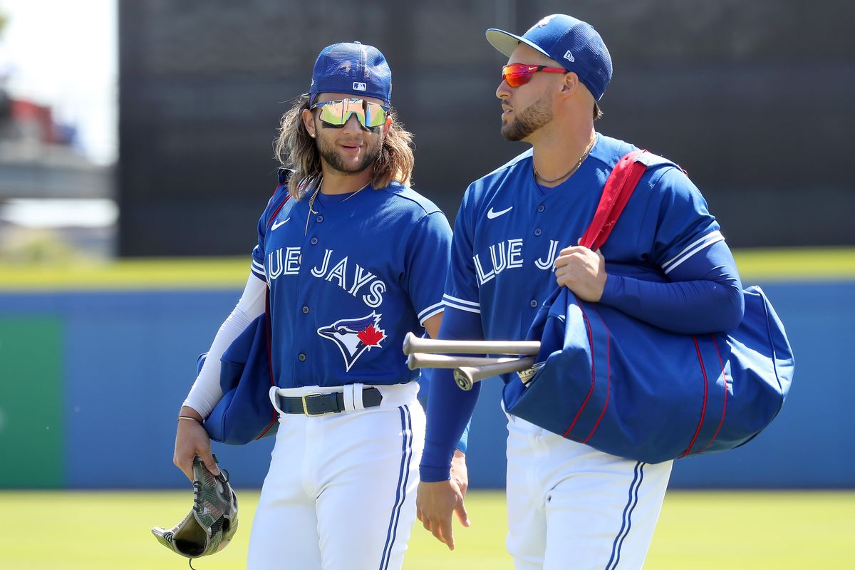 The Blue Jays are lucky to have vaccinated players like Bo Bichette (left) and George  Springer.