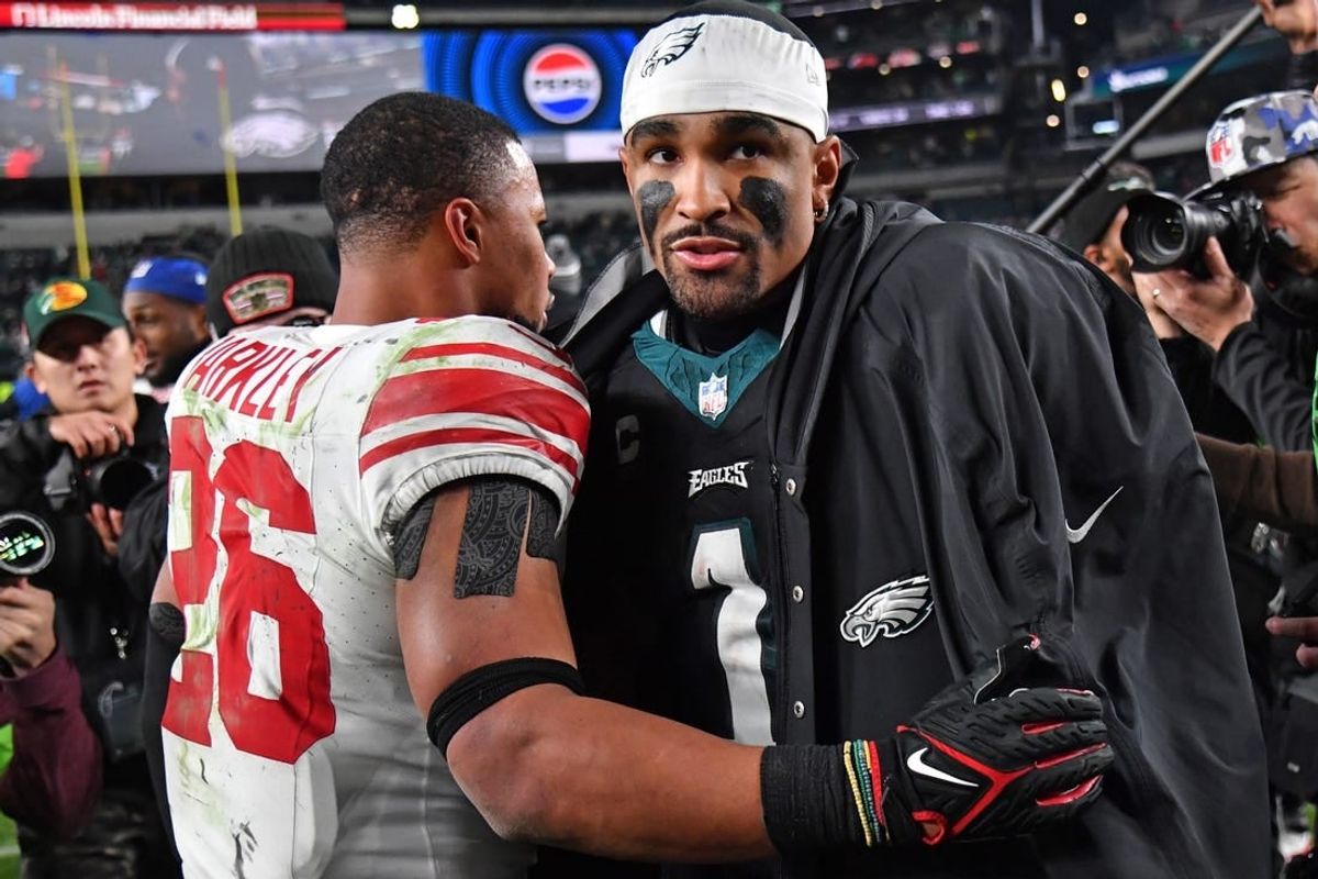 Dec 25, 2023; Philadelphia, Pennsylvania, USA; New York Giants running back Saquon Barkley (26) and Philadelphia Eagles quarterback Jalen Hurts (1) after game at Lincoln Financial Field.