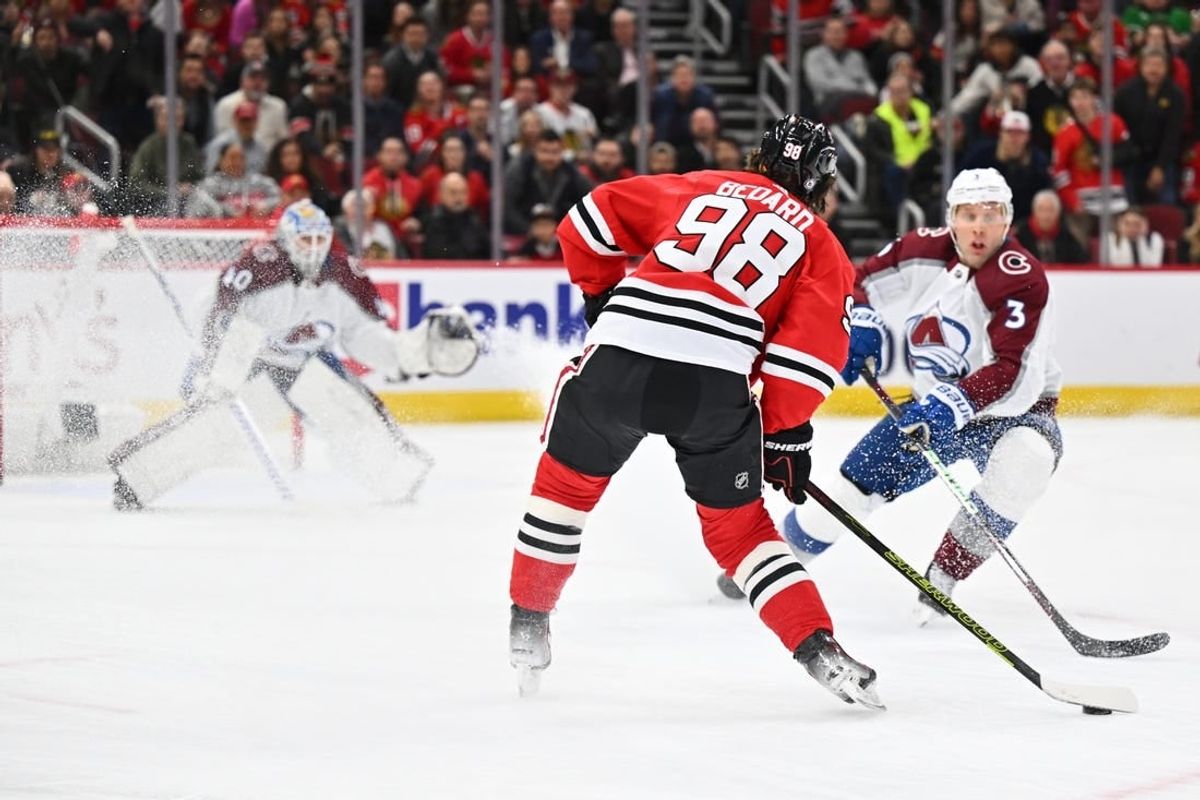 Dec 19, 2023; Chicago, Illinois, USA; Chicago Blackhawks forward Connor Bedard (98) attempts a shot on goal in the first period against the Colorado Avalanche at United Center.