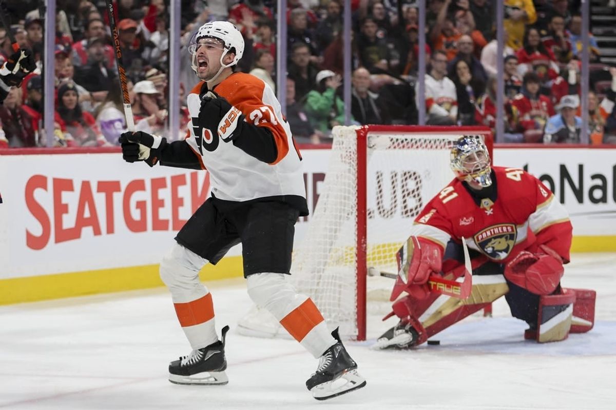 Feb 6, 2024; Sunrise, Florida, USA; Philadelphia Flyers left wing Noah Cates (27) celebrates after scoring against Florida Panthers goaltender Anthony Stolarz (41) during the third period at Amerant Bank Arena.