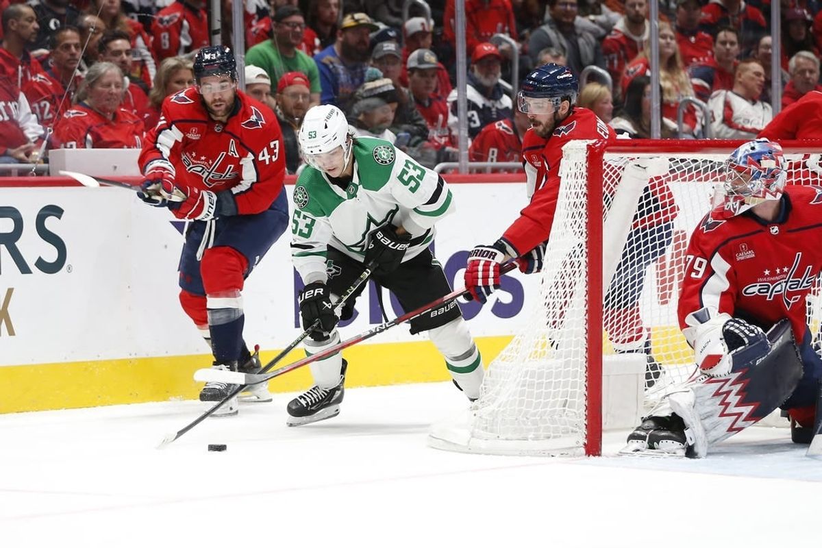 Dec 7, 2023; Washington, District of Columbia, USA; Dallas Stars center Wyatt Johnston (53) controls the puck as Washington Capitals defenseman Joel Edmundson (6) defends during the second period at Capital One Arena.