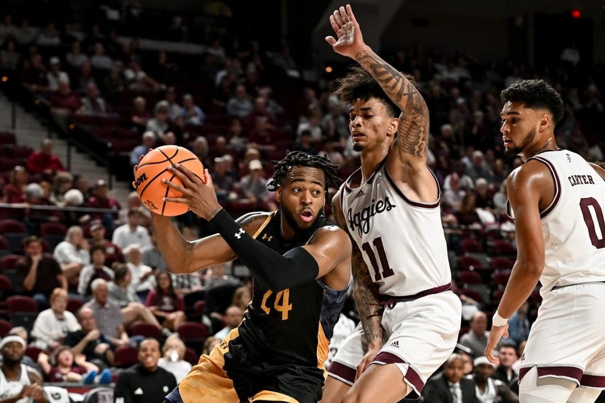 Nov 6, 2023; College Station, Texas, USA; Texas A&M Commerce forward Jerome Brewer Jr. (24) controls the ball as Texas A&M Aggies forward Andersson Garcia (11) defends during the first half at Reed Arena.