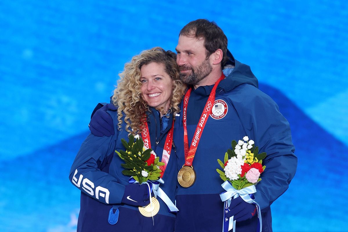Lindsey Jacobellis and Nick Baumgartner teamed up to take the first mixed snowboarding cross event  gold.