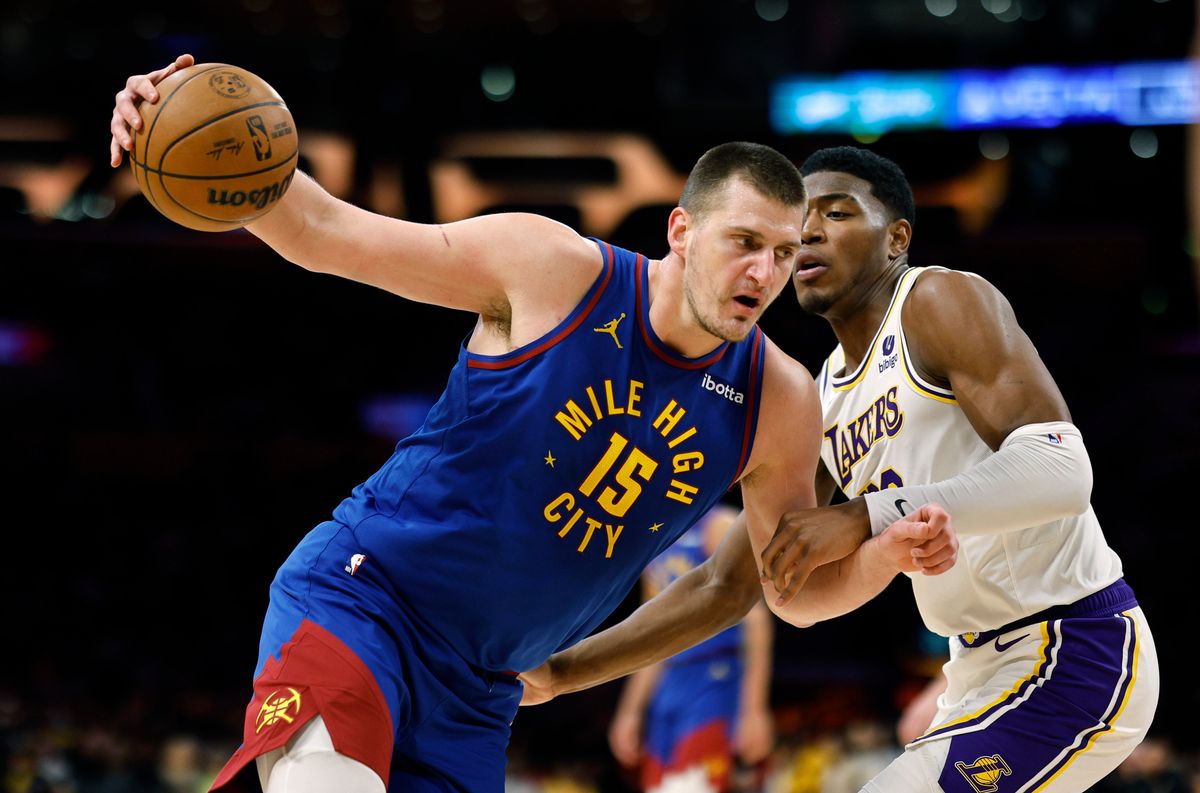 Nikola Jokic of the Denver Nuggets spins around  Rui Hachimura of the Los Angeles Lakers during the first half at Crypto.com Arena on March 2, 2024, in Los Angeles.