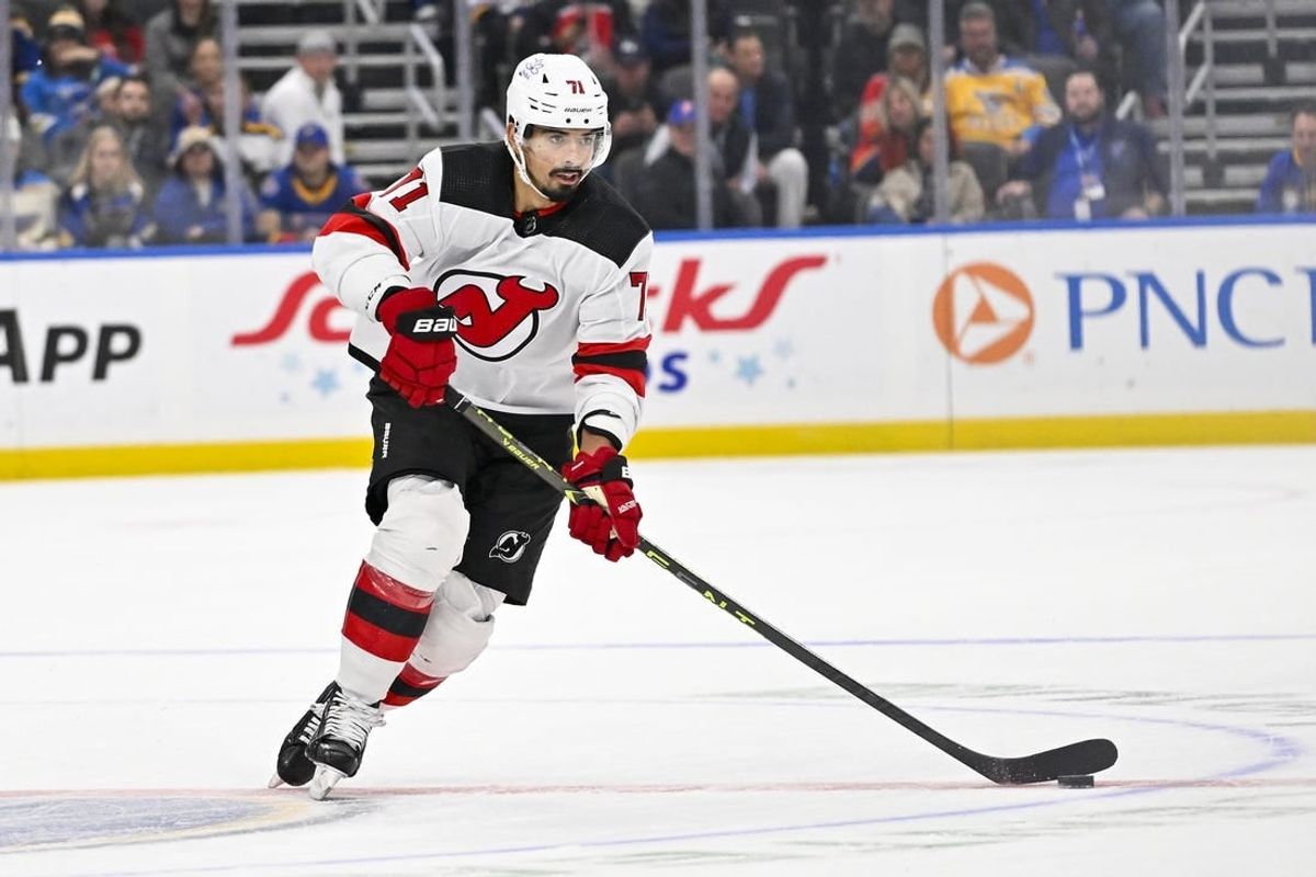 Nov 3, 2023; St. Louis, Missouri, USA;  New Jersey Devils defenseman Jonas Siegenthaler (71) controls the puck against the St. Louis Blues during the first period at Enterprise Center.