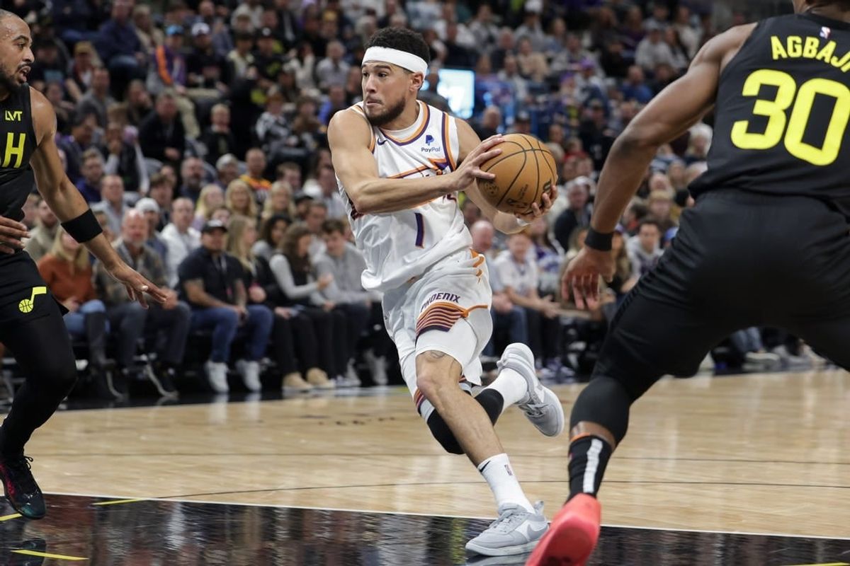Nov 19, 2023; Salt Lake City, Utah, USA;  Phoenix Suns guard Devin Booker (1) drives to the basket during the second quarter against the Utah Jazz at Delta Center.