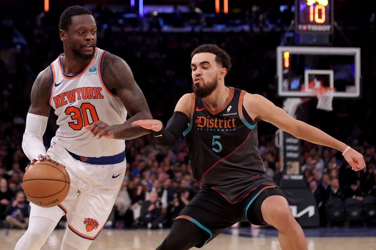 Jan 18, 2024; New York, New York, USA; New York Knicks forward Julius Randle (30) drives to the basket against Washington Wizards guard Tyus Jones (5) during the second quarter at Madison Square Garden.