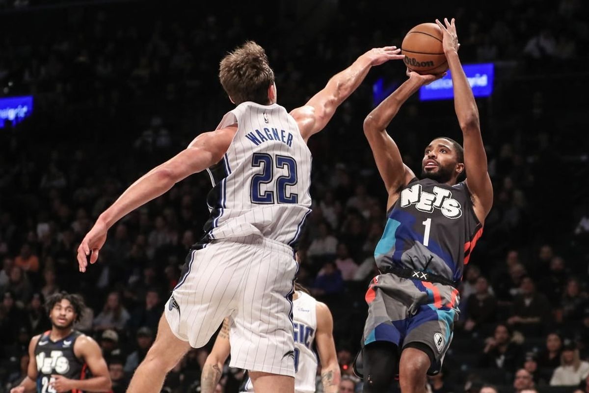 Dec 2, 2023; Brooklyn, New York, USA;  Brooklyn Nets forward Mikal Bridges (1) shoots over Orlando Magic forward Franz Wagner (22) in the fourth quarter at Barclays Center.