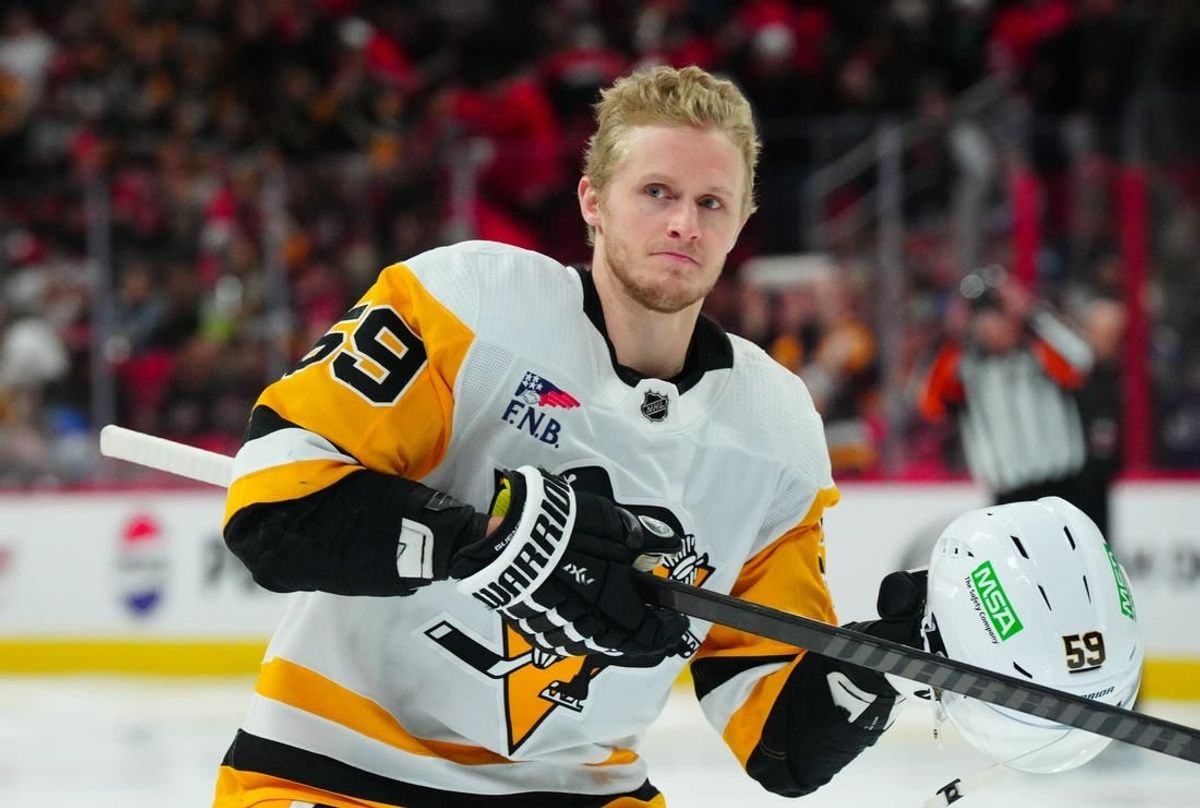 Jan 13, 2024; Raleigh, North Carolina, USA;  Pittsburgh Penguins left wing Jake Guentzel (59) looks on at the start of the game against the Carolina Hurricanes at PNC Arena.
