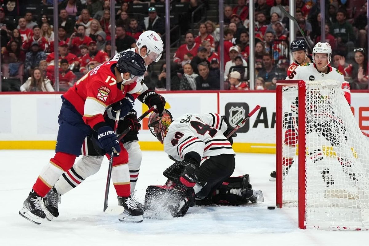 Nov 12, 2023; Sunrise, Florida, USA; Chicago Blackhawks goaltender Arvid Soderblom (40) allows a goal to Florida Panthers center Sam Reinhart (13) during the second period at Amerant Bank Arena.