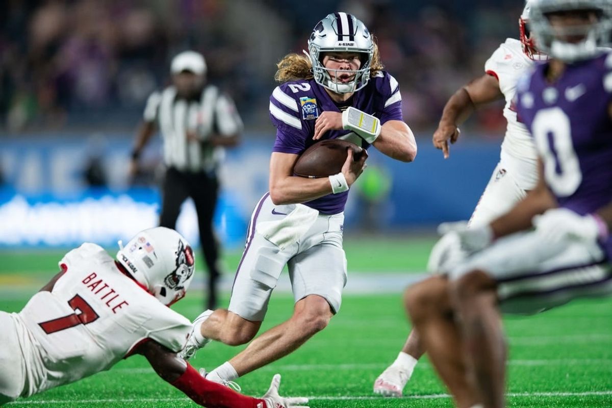Dec 28, 2023; Orlando, FL, USA; Kansas State quarterback Avery Johnson (2) runs for the touchdown against NC State in the second quarter at Camping World Stadium.