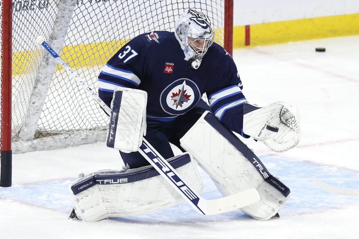 Jan 2, 2024; Winnipeg, Manitoba, CAN;  Winnipeg Jets goaltender Connor Hellebuyck (37) warms up before a game against the Tampa Bay Lightning at Canada Life Centre.